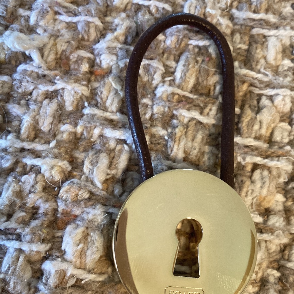 Coach gold tone round key ring with brown closer for adding keys securely. - Picture 2 of 5